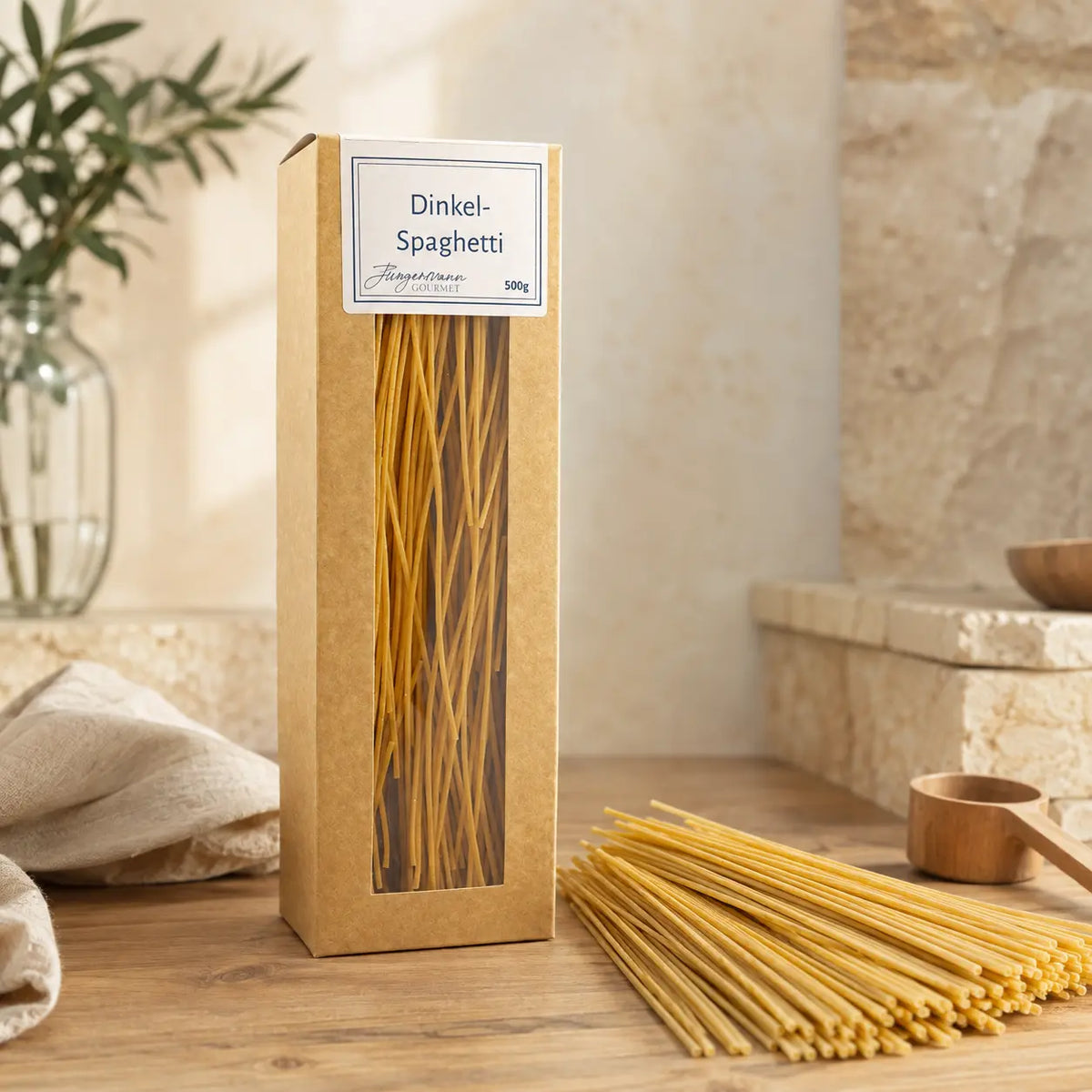 Dinkel-Spaghetti von Jungermann Gourmet mit Bündel ungekochter Spaghetti