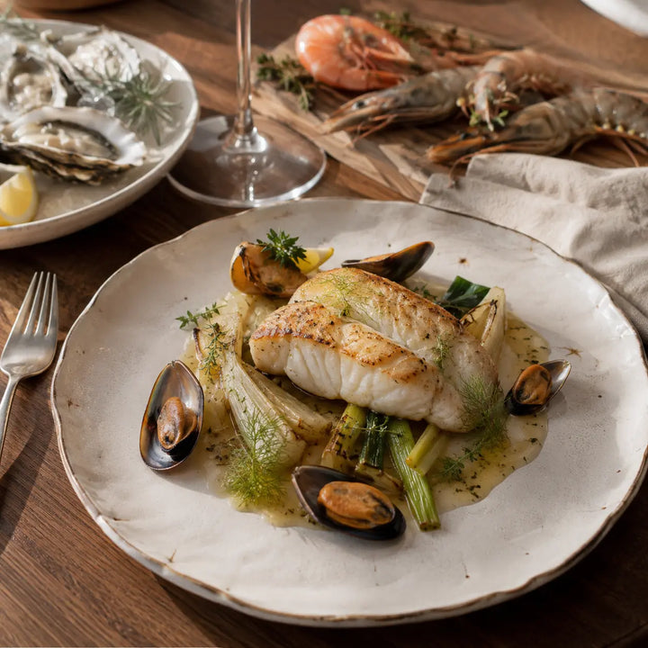 Fisch und Meeresfrüchte – angerichtetes Fischfilet mit Fenchel und Muscheln