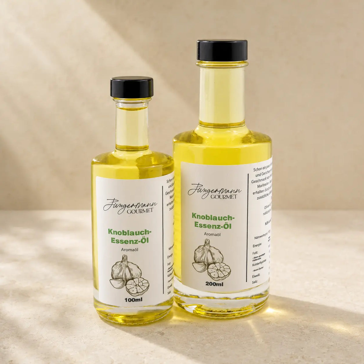 Knoblauch-Essenzöl von Jungermann Gourmet in den originalen 100-ml- und 200-ml-Glasflaschen