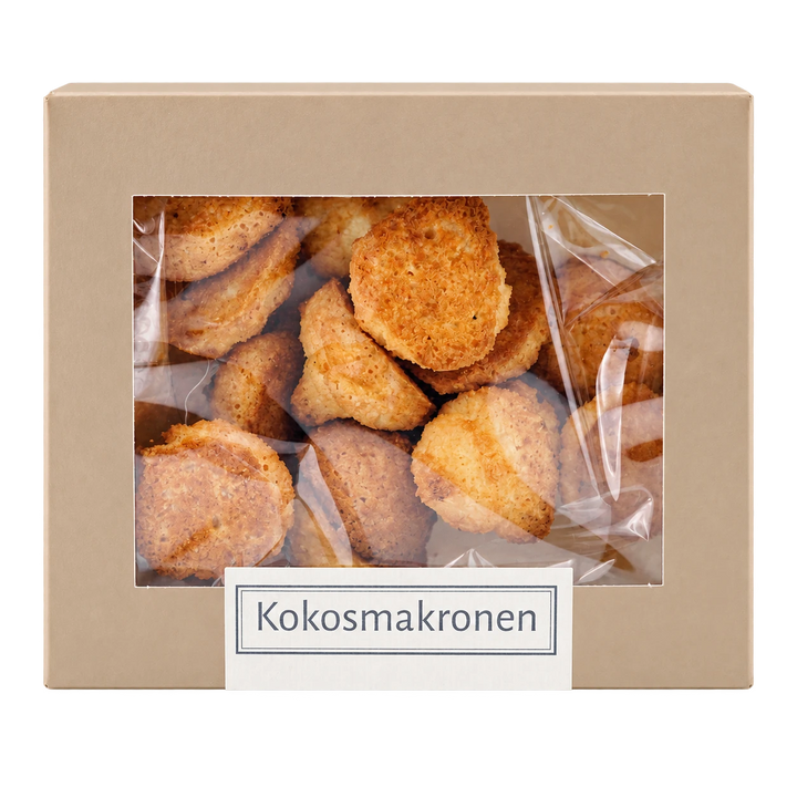 Kokosmakronen von Jungermann Gourmet in der Gebäckschachtel mit Sichtfenster – freigestellte Frontalansicht.