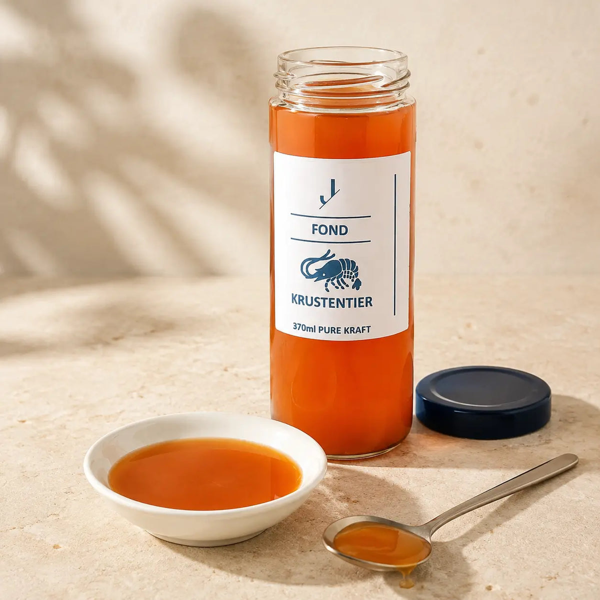Krustentier-Fond von Jungermann Gourmet im Originalglas mit sichtbarer Textur