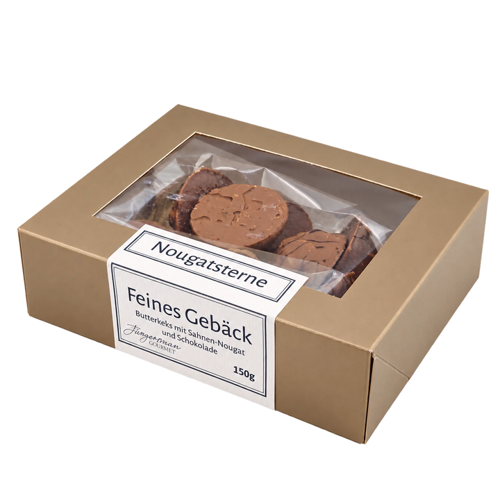 Nougatsterne von Jungermann Gourmet in der Gebäckschachtel mit Sichtfenster – freigestellte Produktansicht.
