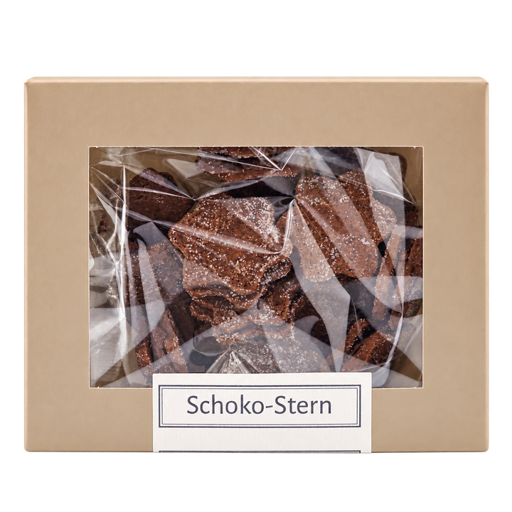 Schoko-Sterne von Jungermann Gourmet in der Gebäckschachtel mit Sichtfenster – freigestellte Frontalansicht.