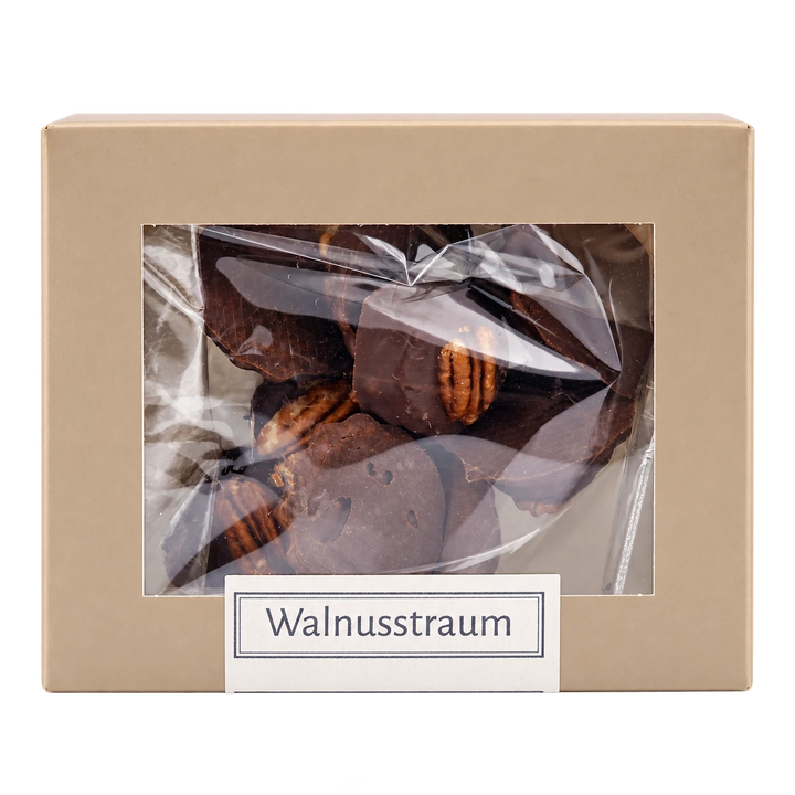 Walnusstraum von Jungermann Gourmet in der Gebäckschachtel mit Sichtfenster – freigestellte Frontalansicht.