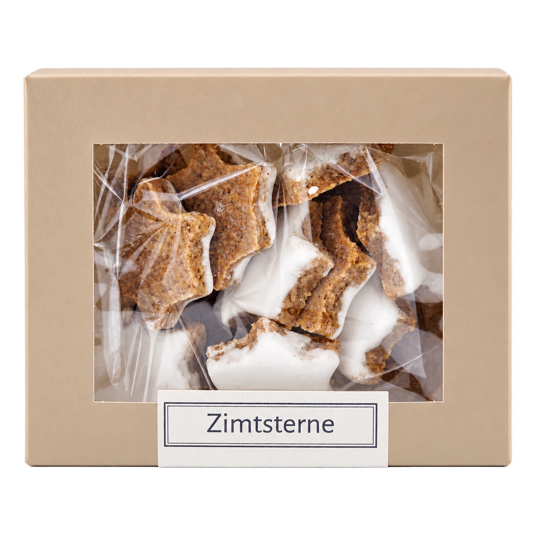Zimtsterne von Jungermann Gourmet in der Gebäckschachtel mit Sichtfenster – freigestellte Frontalansicht.