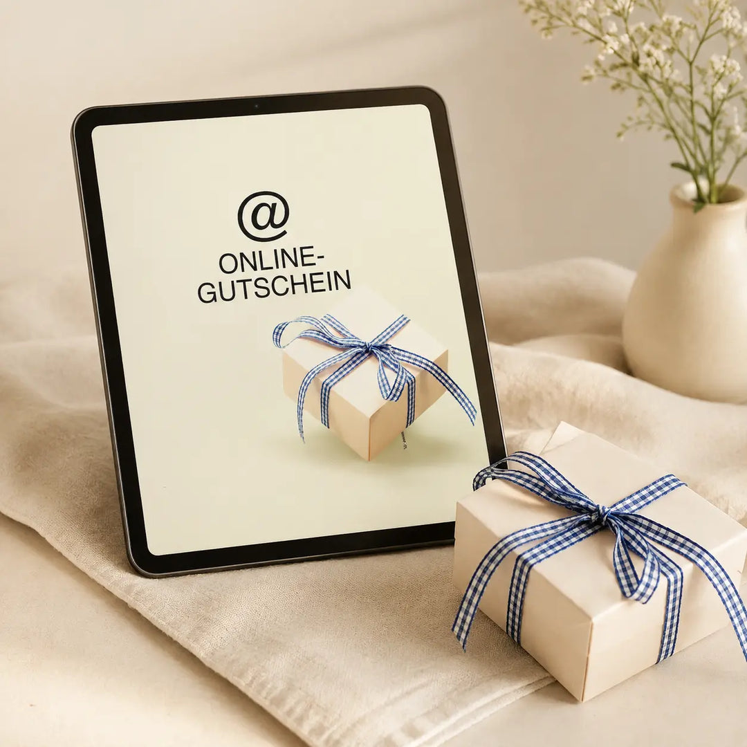 Jungermann Gourmet Online-Geschenkgutschein auf Tablet neben Geschenkbox