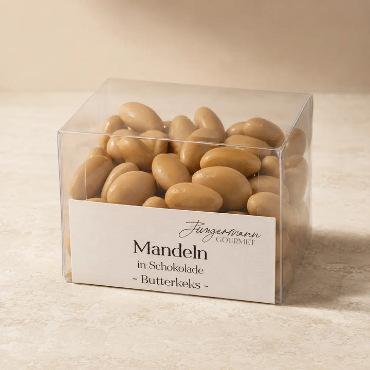 Mandeln in Schokolade Butterkeks in der originalen Klarsichtbox als Packshot