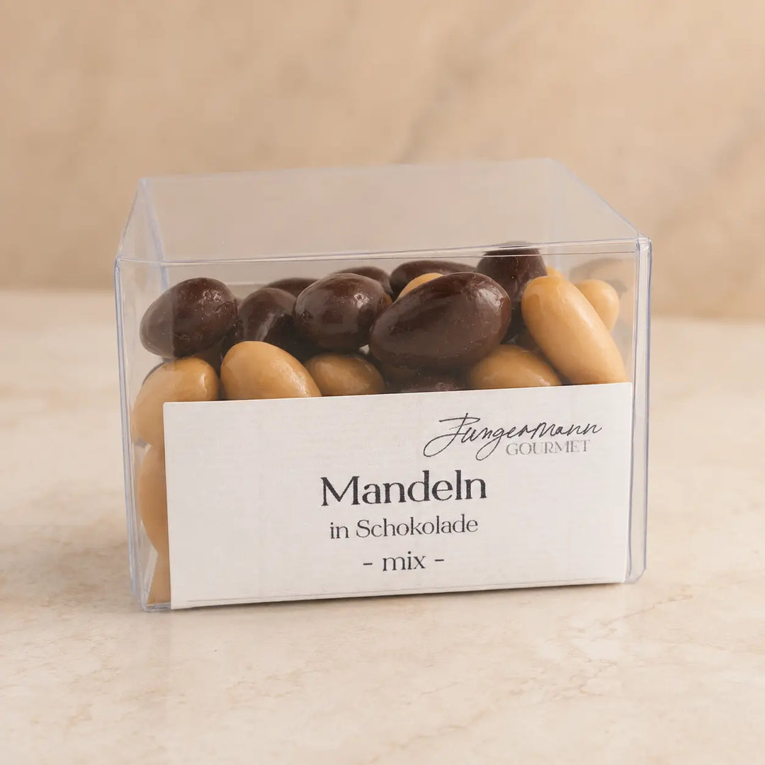 Mandeln in Schokolade Mix in der originalen Klarsichtbox als Packshot